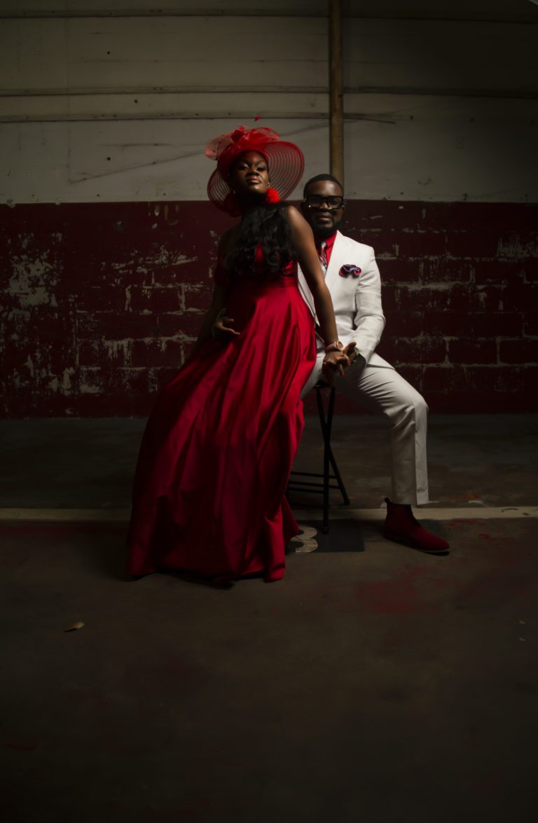 Man and woman sitting on a stool