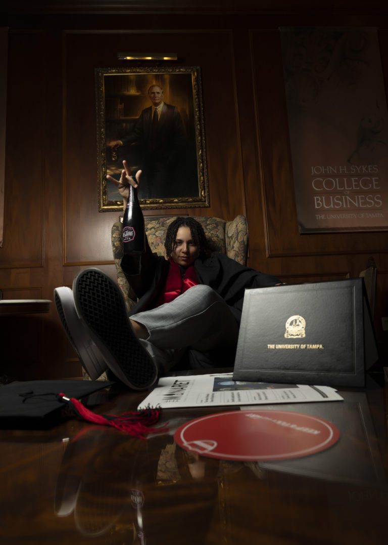 Person sitting in a chair with feet on the table