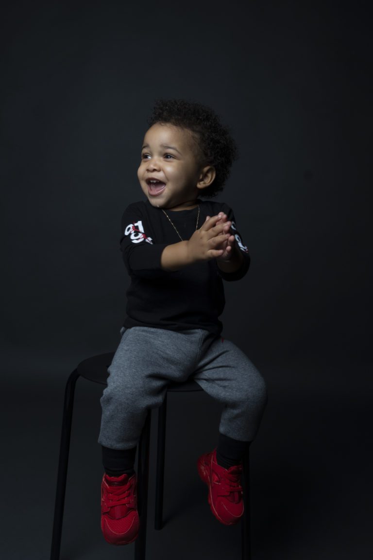 Young boy sitting on a chair