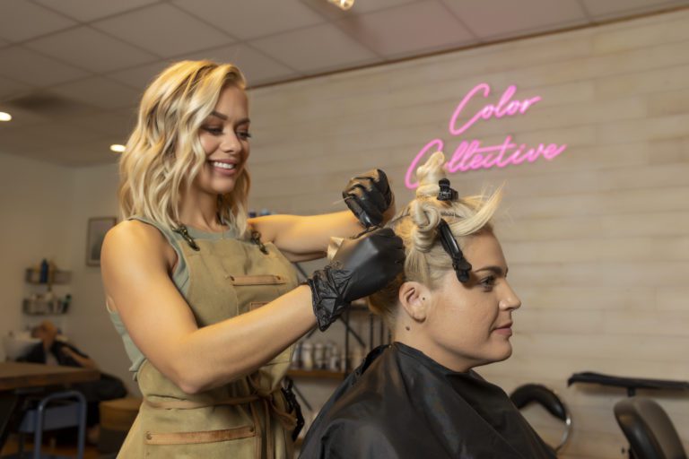 Hair stylist doing a woman's hair